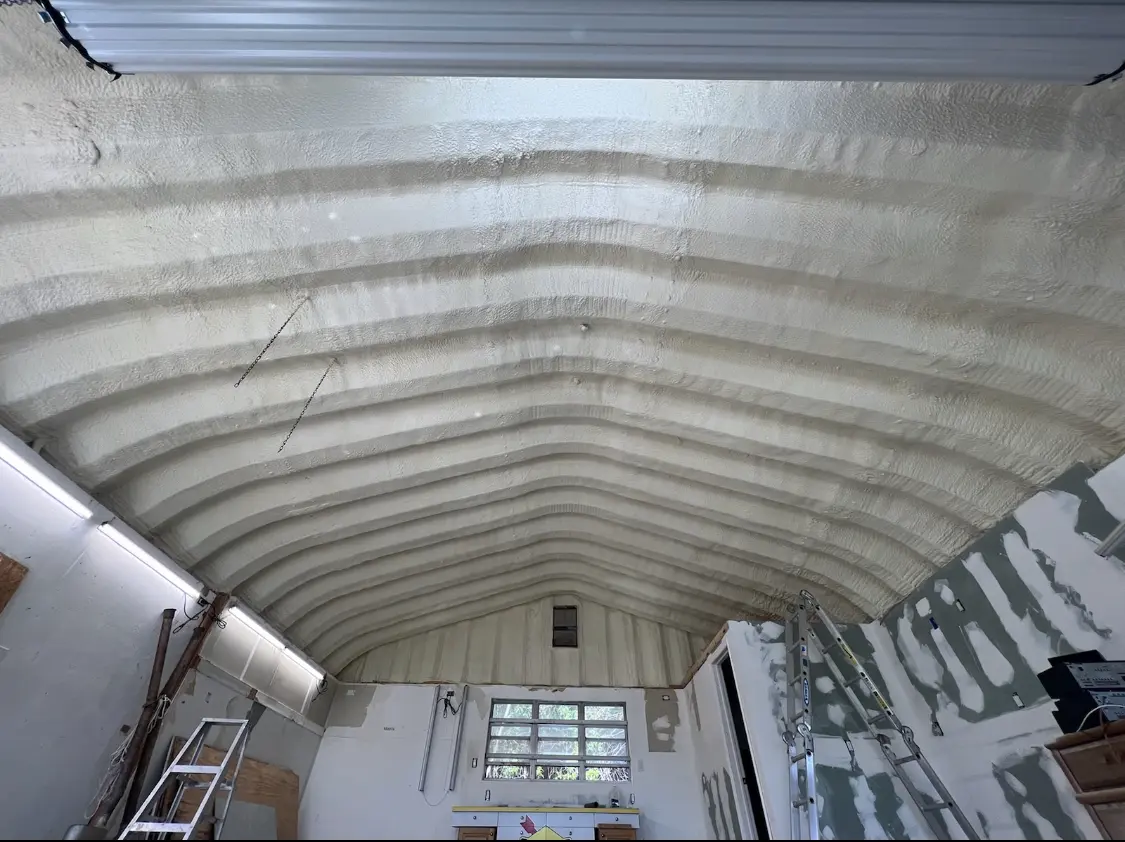Spray polyurethane foam applied to the underside of a metal roof deck in West Salem